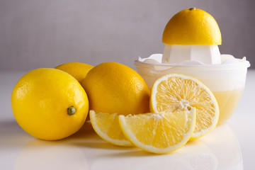 Lemon and juice on a white background