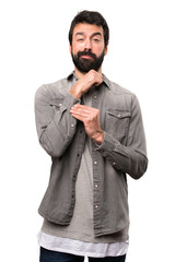 Fototapeta premium Handsome man with beard proud of himself on white background