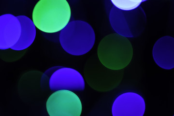 blue and green bokhe glowing in the dark