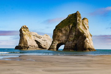 New Zealand wharariki beach and arch island rock formations - 189749706