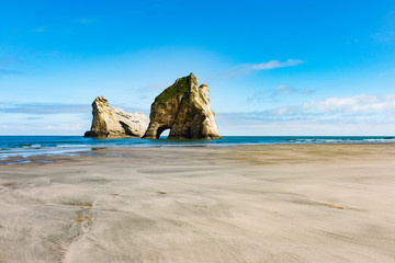 New Zealand wharariki beach and arch island rock formations - 189750126
