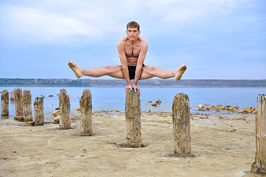 Muscular Man Yogi Makes A Stand On His Hands