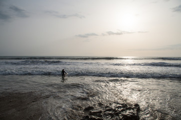 Surfer going into the water.