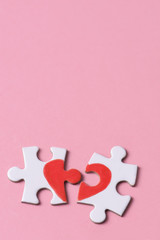 puzzle pieces which form a heart
