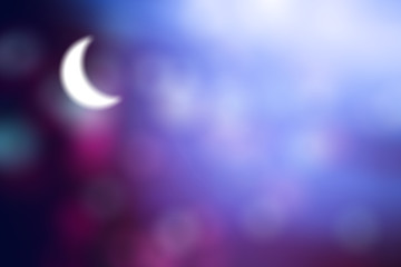 Crescent moon on a blue purple abstract background.