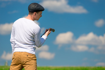 golfer checks his golf club before hitting the ball on the field