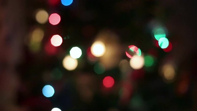 Decorated Christmas tree on blurred, sparkling and fairy background