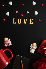 Flat view of notepads with valentines hearts and decoration on dark background with copy space. Symbol of love. Happy Valentines Day background.Saint Valentine's Day concept.
