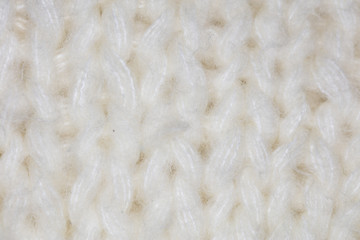 white fabric, patterned closeup on stitch