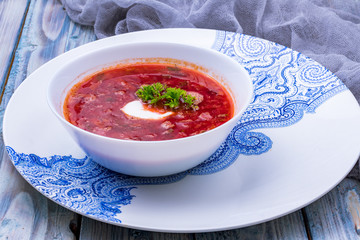 Borscht on a blue wooden background
