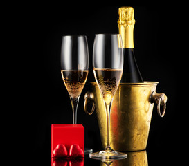 Valentine's day with champagne, gift and chocolate candies  in the shape of a heart