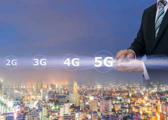 Businessmen hold a smartphone with digital pattern to view social data 5G networking concept.