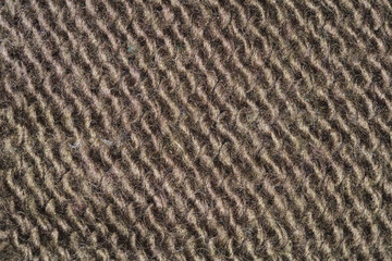 brown fabric texture, closeup on stitch