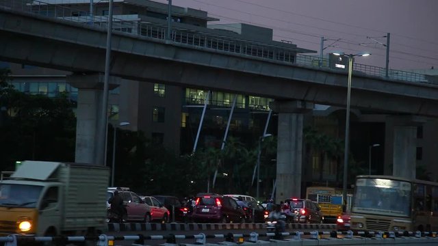 Traffic on busy city, Chennai city main center heavy traffic crossing a bridge and Busy rush hour street scene at chennai, India.