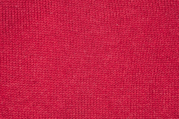 red fabric texture, closeup on stitch
