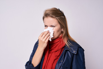 Bad feeling. Young girl with cold. Light background