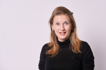 Obraz premium Young girl. Surprise expression. White background. Blonde hair