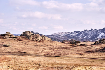 Beautiful scenery. Mountain landscape. Gray stones. Dry grass