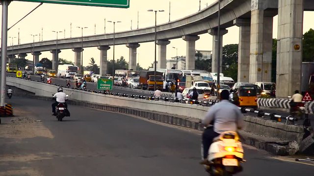 Traffic on busy city, Chennai city main center heavy traffic crossing a bridge and Busy rush hour street scene at chennai, India.