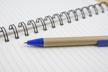 Pen on a white sheet. Macro image with shallow depth of focus.