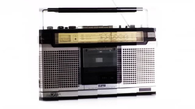 a selection of vintage ghettoblasters and radios spinning around. it is filmed in a way that the objects change as they rotate