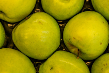 Closeup of crates of juicy, fresh, ecologically produced apples, Fuji, without nitrates. Captured in the market for fruits and vegetables. Concept health and agriculture.