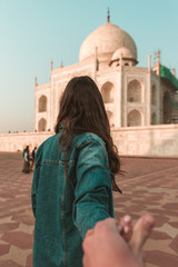 female tourist seen from behind at Taj Mahal, Agra, Uttar Pradesh