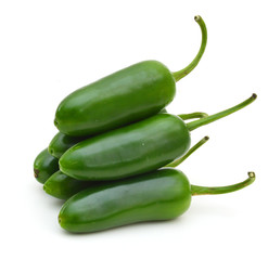 bunch of fresh green chili peppers  on a white background