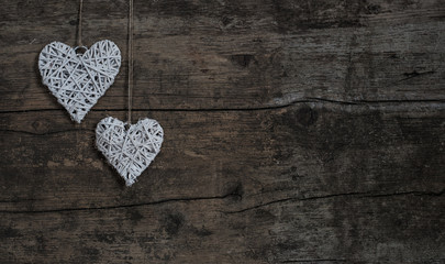 Shabby hearts on rustic wood background