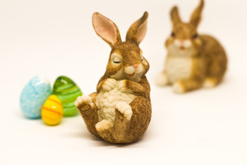 Sleepy easter bunny with friend  and glass eggs