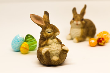 Sleepy easter Bunny with friend and glass eggs