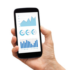 Hand holding a black smart phone with graphs and charts elements on screen. Isolated on white background. All screen content is designed by me.