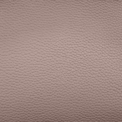 A piece of lilac artificial leather texture closeup