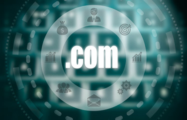 A dot com concept on a futuristic computer display over a blured image of a keyboard.
