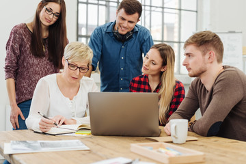 Group of young business people discussing ideas