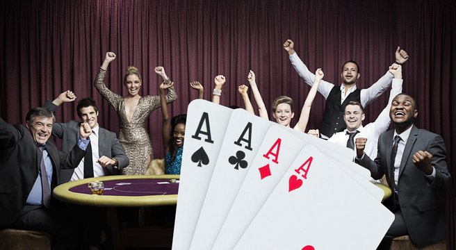 Attractive group cheering at the casino with digital hand of