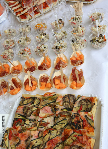Buffet With Rice Pizza And Ham With Melon During The Wedding