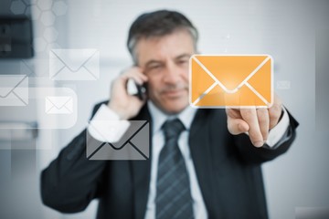 Businessman selecting new mail symbol on touchscreen