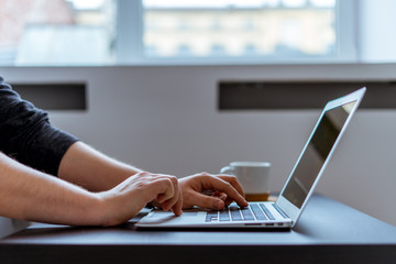 Working at the studio while drinking coffee