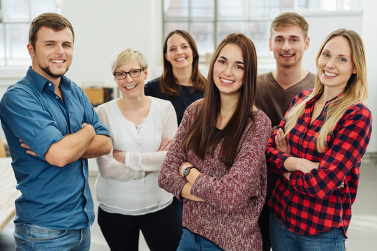 Group of smiling co-workers in office