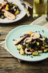 Black rice with prawns, vegetables and orange
