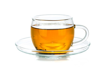 Transparent glass cup of tea isolated on a white background in close-up 