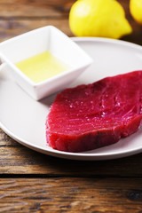 Raw fresh tuna fish on the wooden table