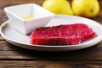 Raw fresh tuna fish on the wooden table