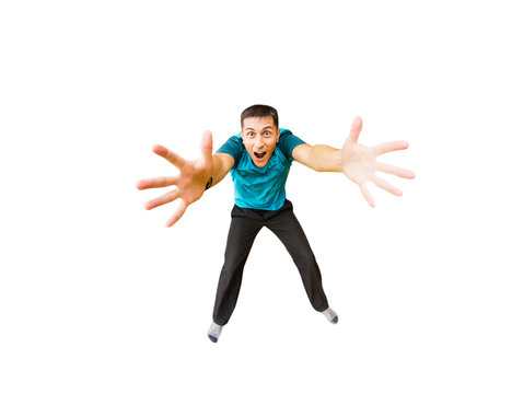 surprised young man flies in widely separated hands isolated on white. Concept fitness or trampoline center
