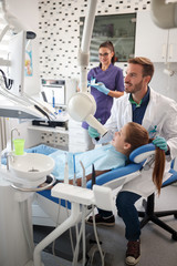 Fototapeta premium Dental specialist make x-ray to little girl