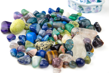 Various tumbled bright coloured green, blue and turquoise semi precious gemstones