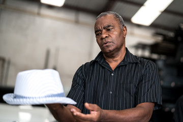 Brazilian Man that like Samba holding his hat