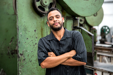 Portrait of Worker on Factory on background
