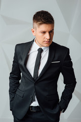Portrait of handsome stylish man in elegant suit